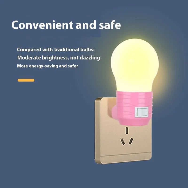 Plug-in bedside baby night light in white shell with modern round design on a table.