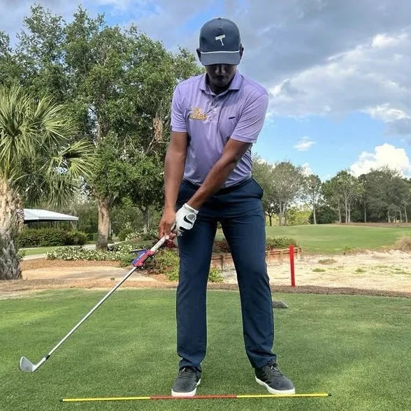 Golf swing plane simulator training aid showing swing path reference structure