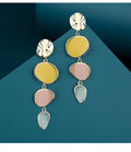 A pair of simple disc-shaped alloy earrings with a blended Morandi three-colour oil drip finish.