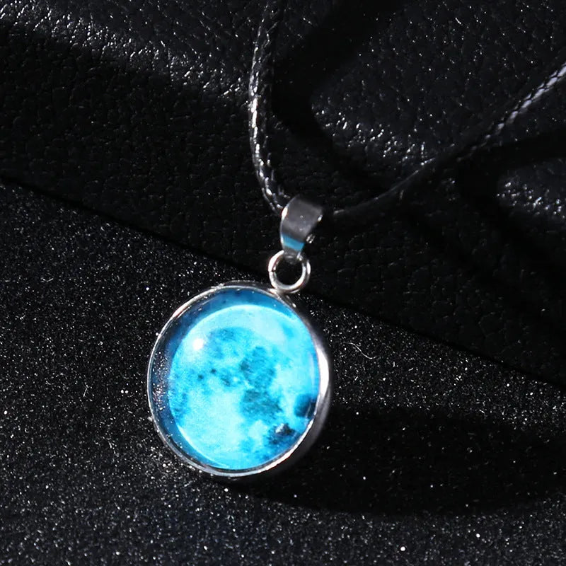 Luminous constellation pendant necklace with adjustable chain on a plain background.