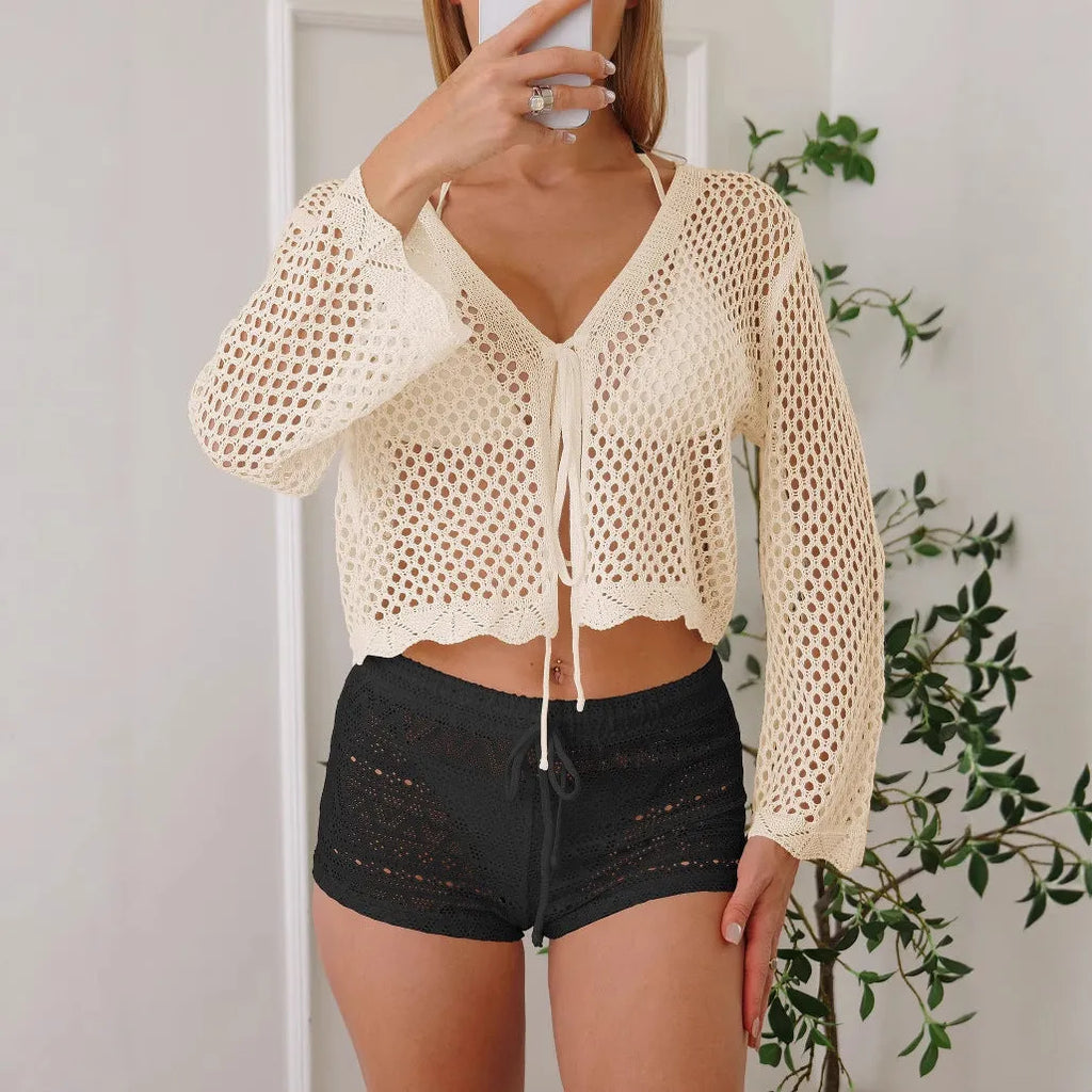 Women's apricot hollow woven cardigan blouse with bell sleeves laid flat