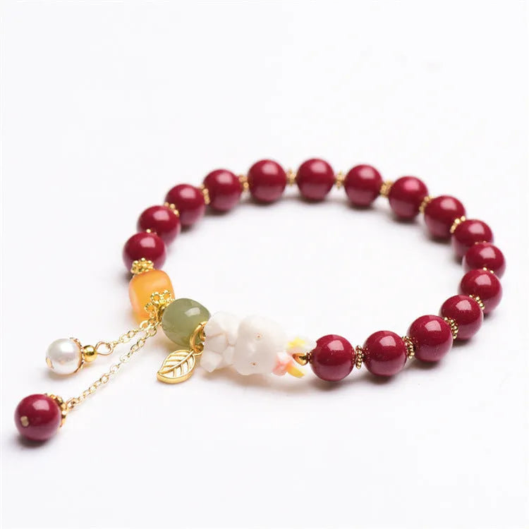 Natural cinnabar bracelet with rabbit motif in traditional Chinese design
