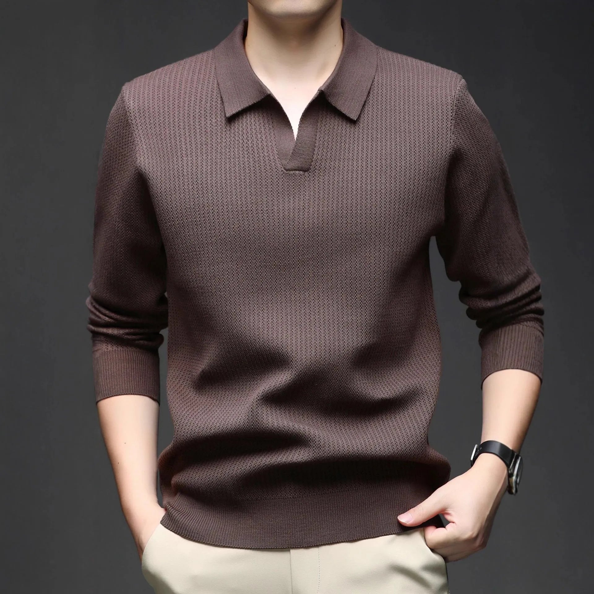 A man's loose-fitting casual pullover jumper in a neutral colour, shown on a model.