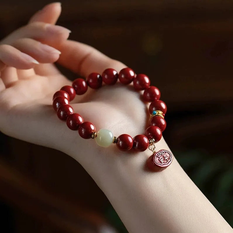 Natural cinnabar Emperor Sandstone Ping An Fu Lu bracelet in 8mm or 10mm bead size.