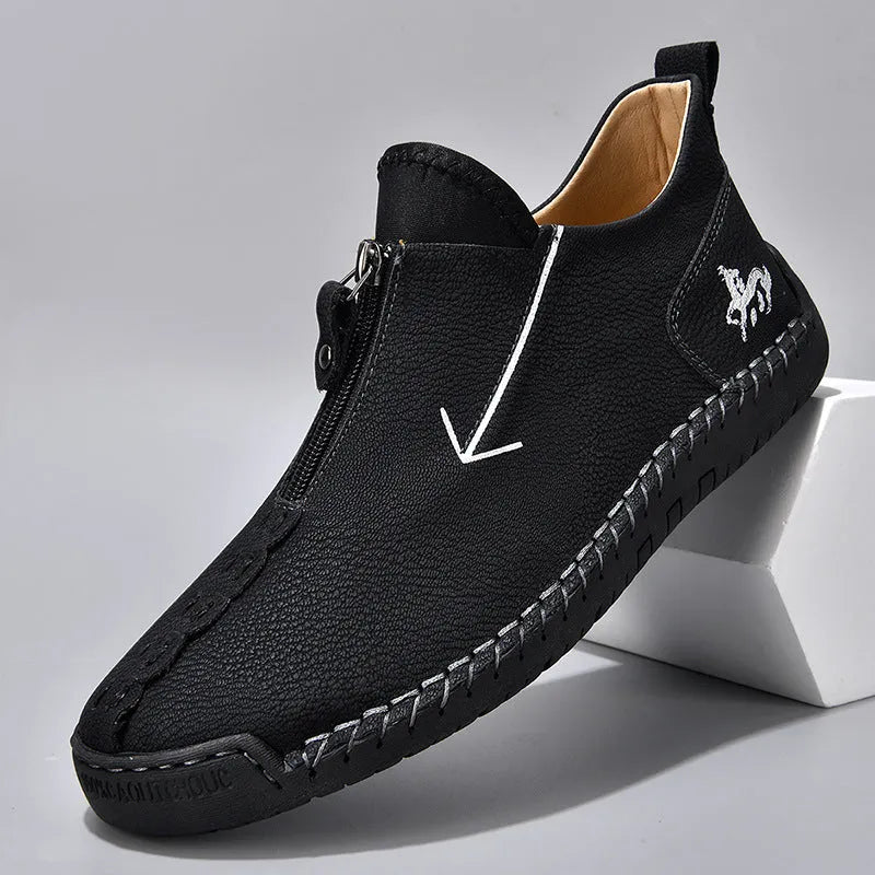 Men's brown leather martin boots with front zipper and hand-stitched detailing