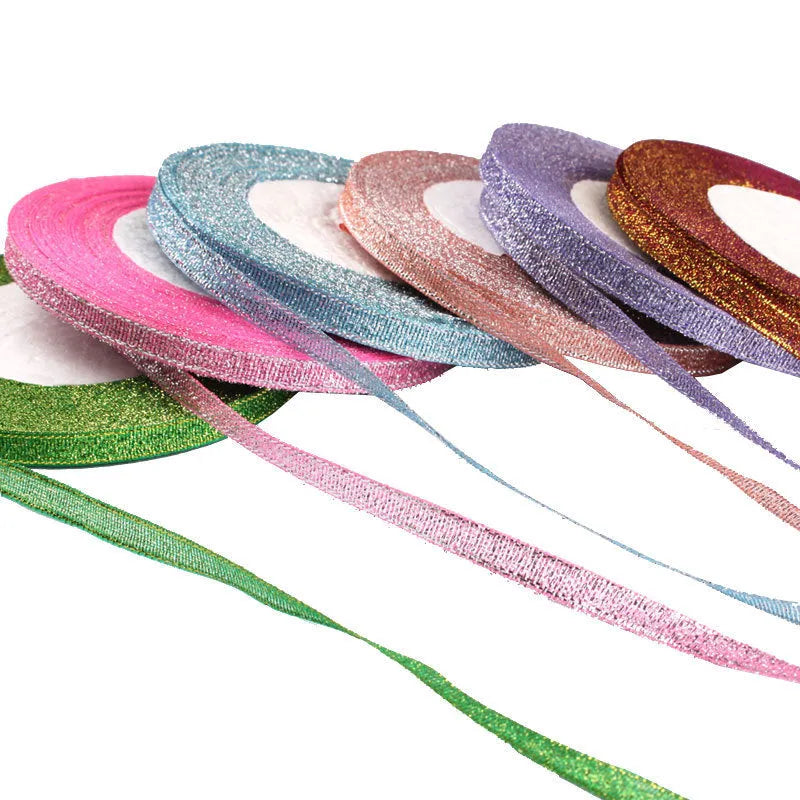 Roll of 0.6cm wide polyester gift ribbon in various colours including gold leaf, coffee and sky blue options