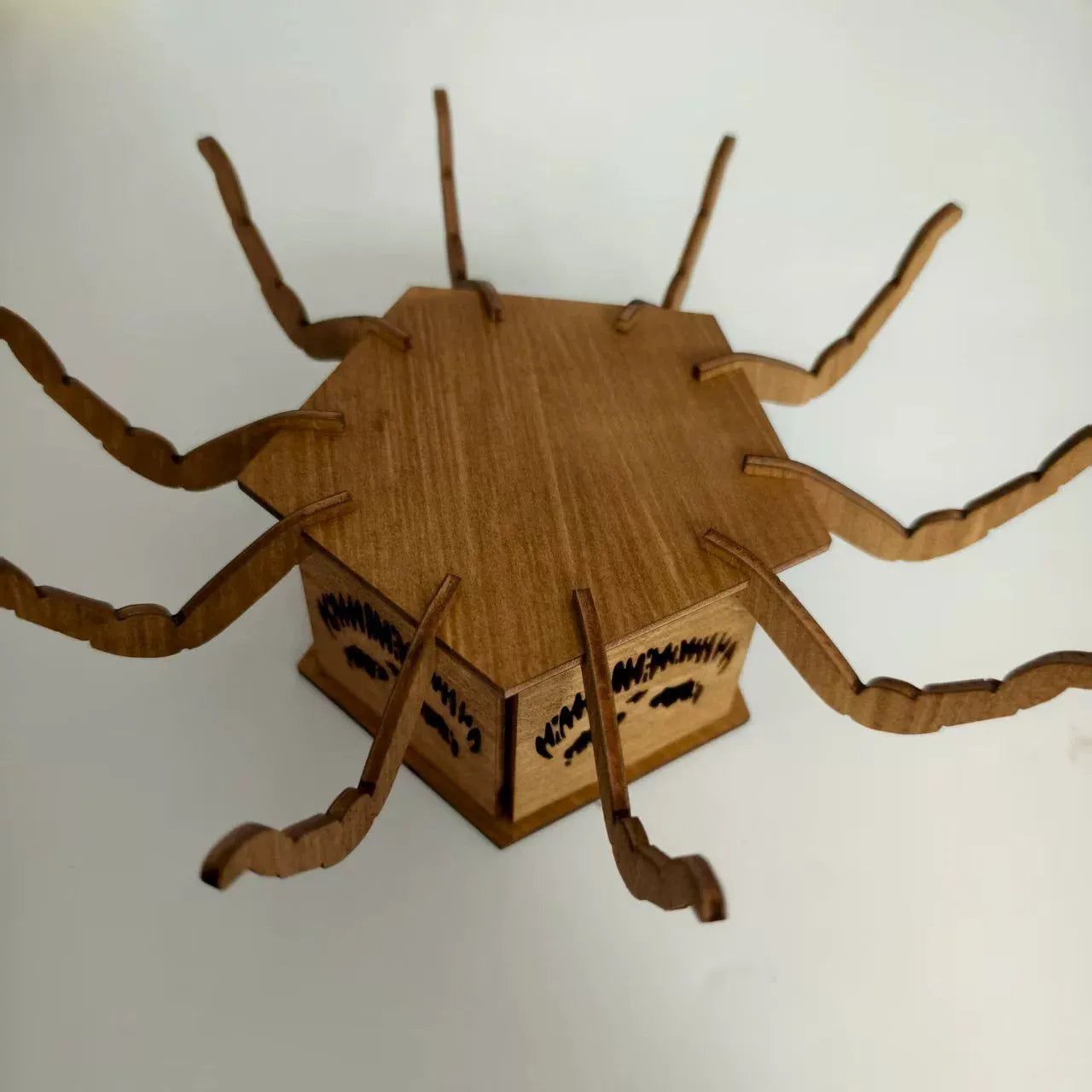 Wooden Halloween candlestick with spider design measuring 21cm by 8.5cm
