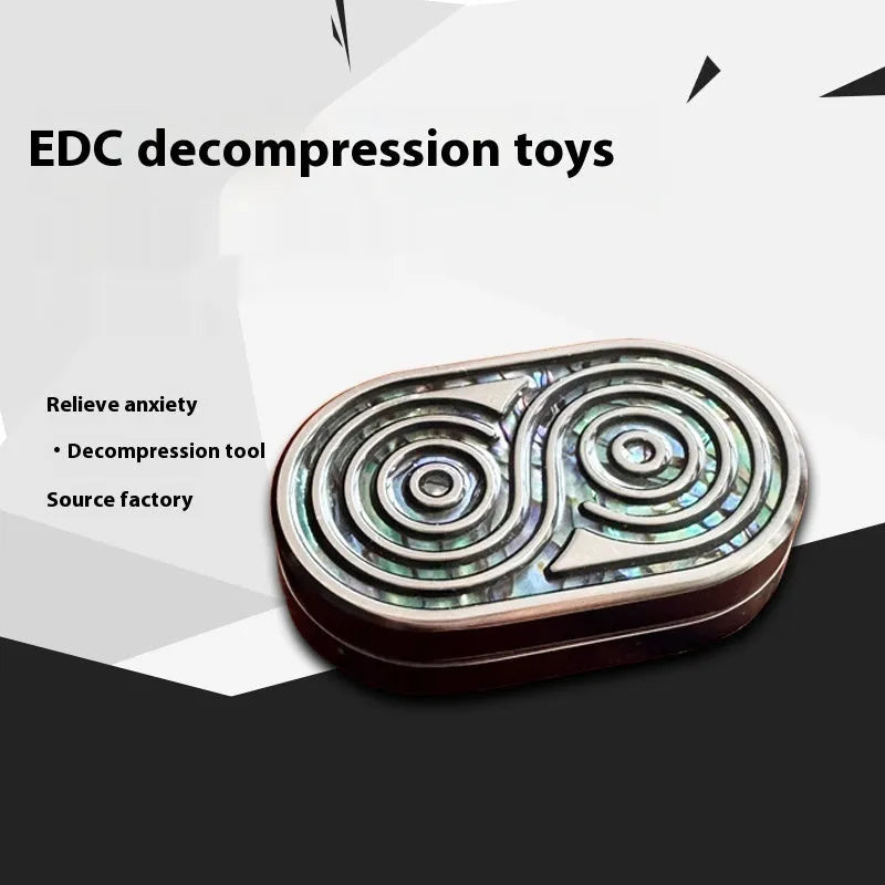 Stainless steel EDC hand push coin in agate red colour on plain background