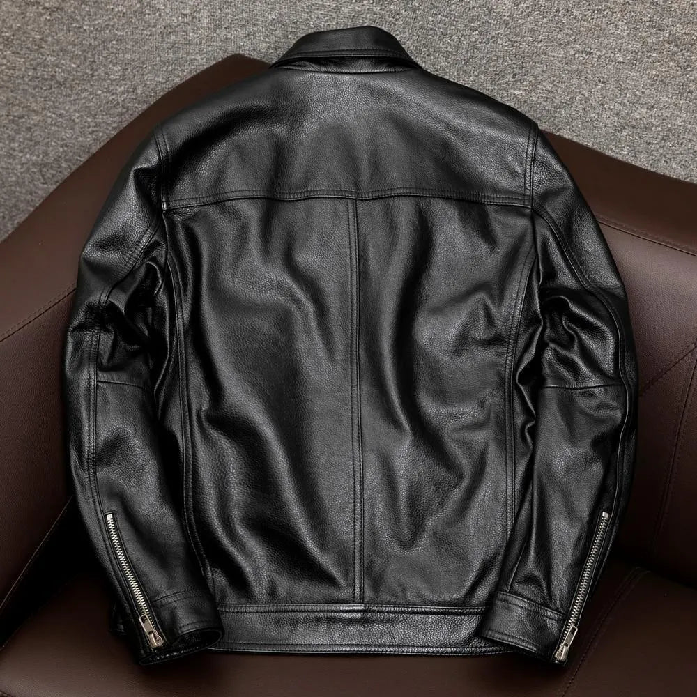 Man wearing a black loose-fit lapel PU leather jacket with side pockets.