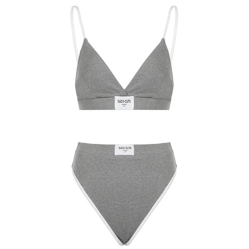 Women's grey bikini set with contrast binding and embroidery detailing, sleeveless with shorts