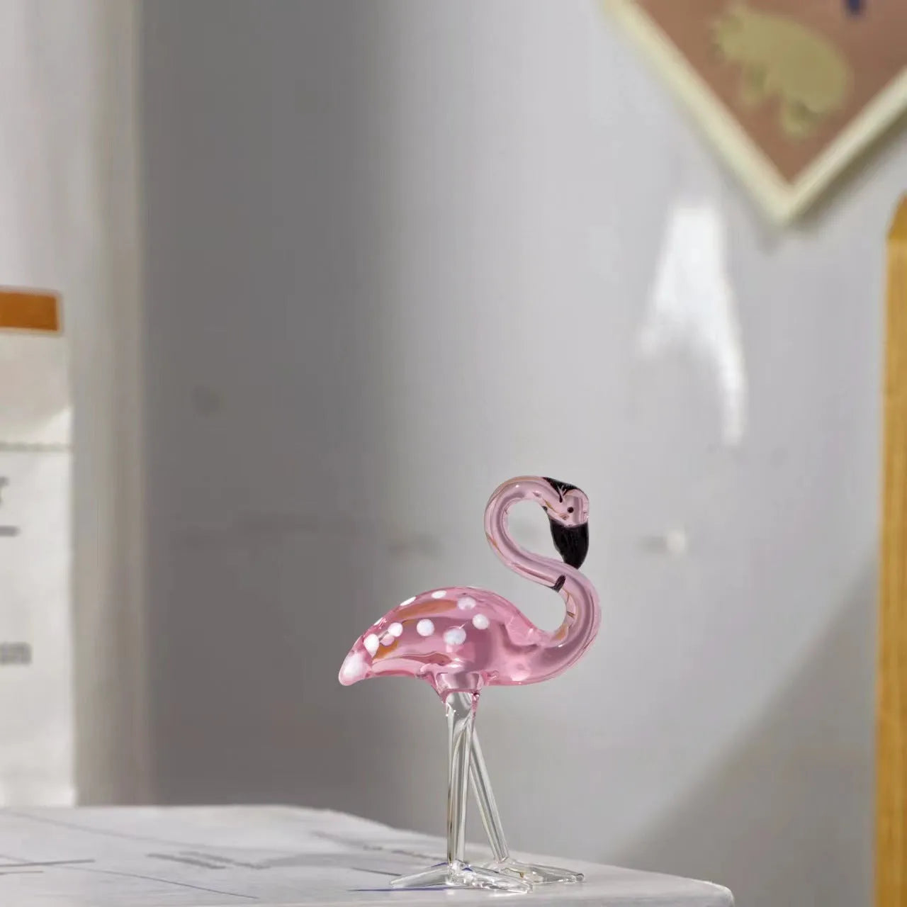 Pink crystal flamingo decorative ornament on tabletop with modern simplicity style