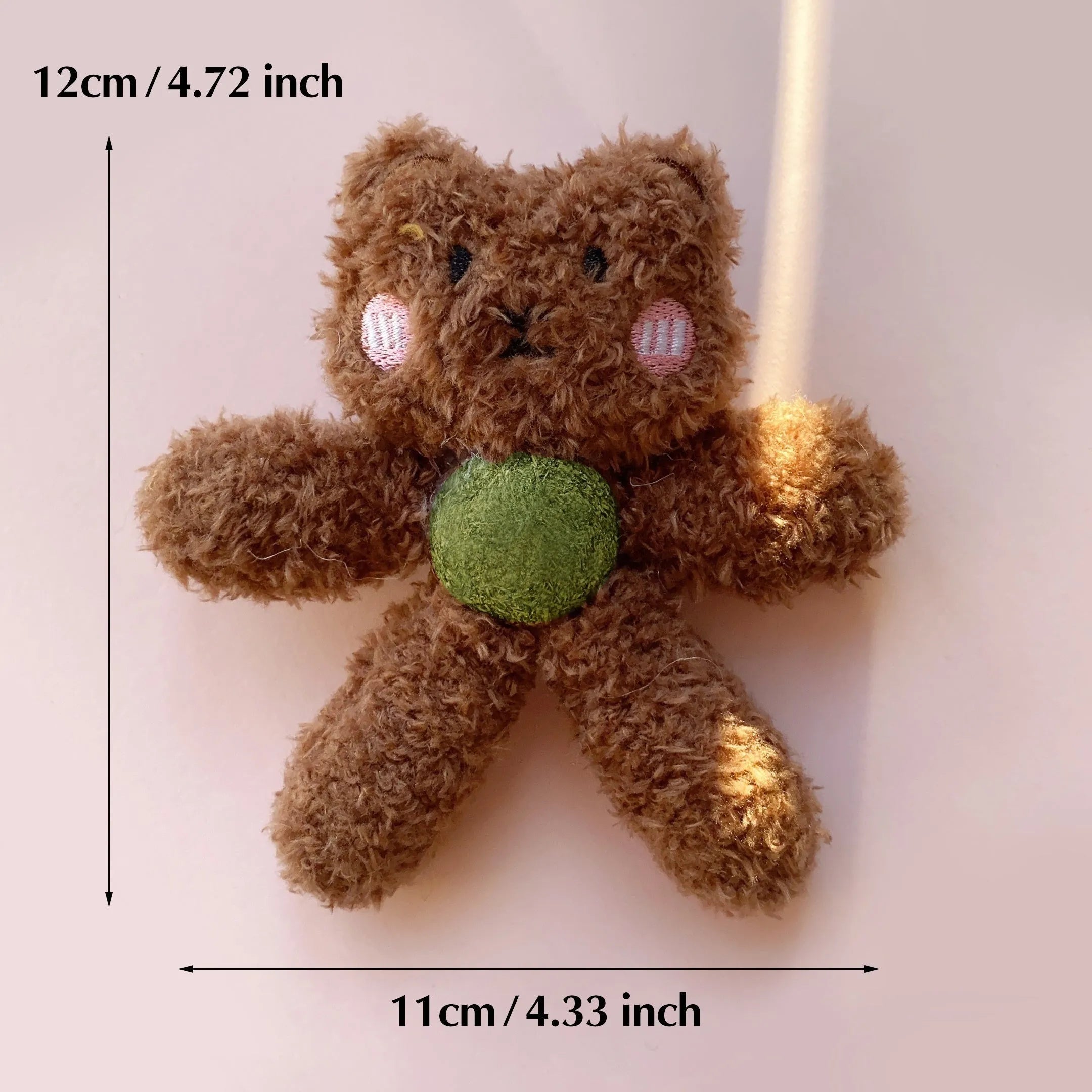 Edible catnip ball chewing toy for cats with plush animal design for dental enrichment