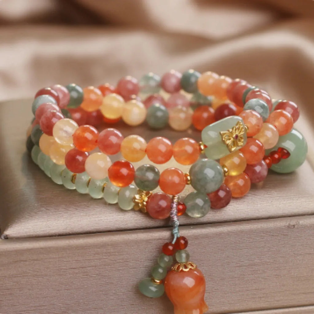 Natural Jinsi Jade multi-circle bracelet with round beads and lily pendant on display