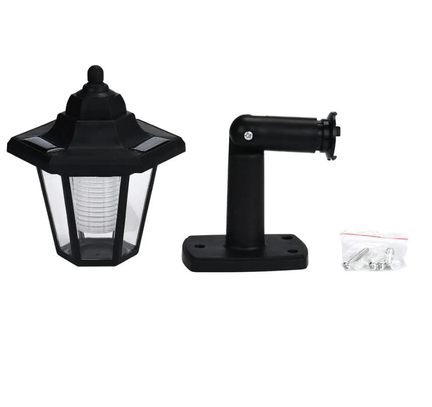 Black hexagonal solar wall lamp with light sensor for outdoor garden lighting