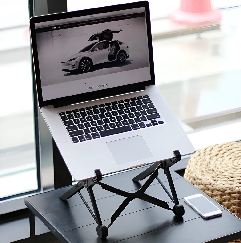 Black reinforced nylon portable folding laptop stand with 35.4cm width, shown in folded position.