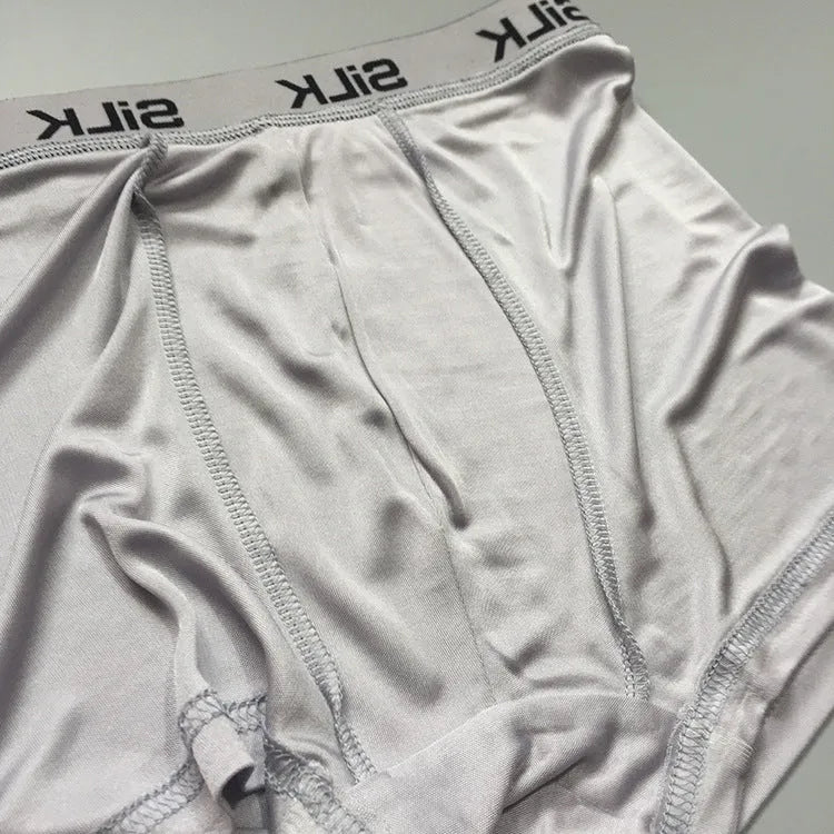 Men's loose fit silk shorts in navy blue, silver grey, and skin colour options