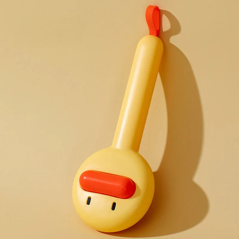 Small yellow plastic duck-shaped pet grooming comb with needle bristles.