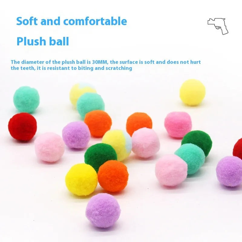 Pet toy launcher gun and soft plush balls for interactive play with cats and dogs.