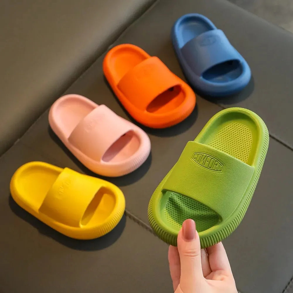 Mixed colour children's EVA slippers with non-slip soles in sizes for ages 24-35.