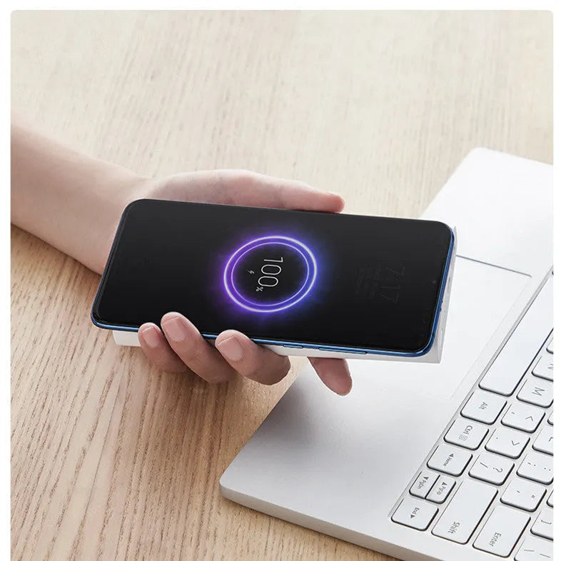 White 10000mAh power bank showing USB-C port and wireless charging surface