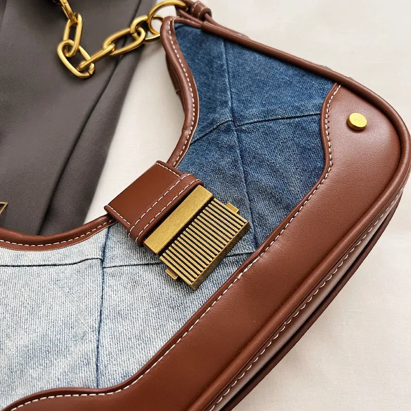 Brown denim bucket shoulder bag with diamond mesh pattern and chain decorative elements