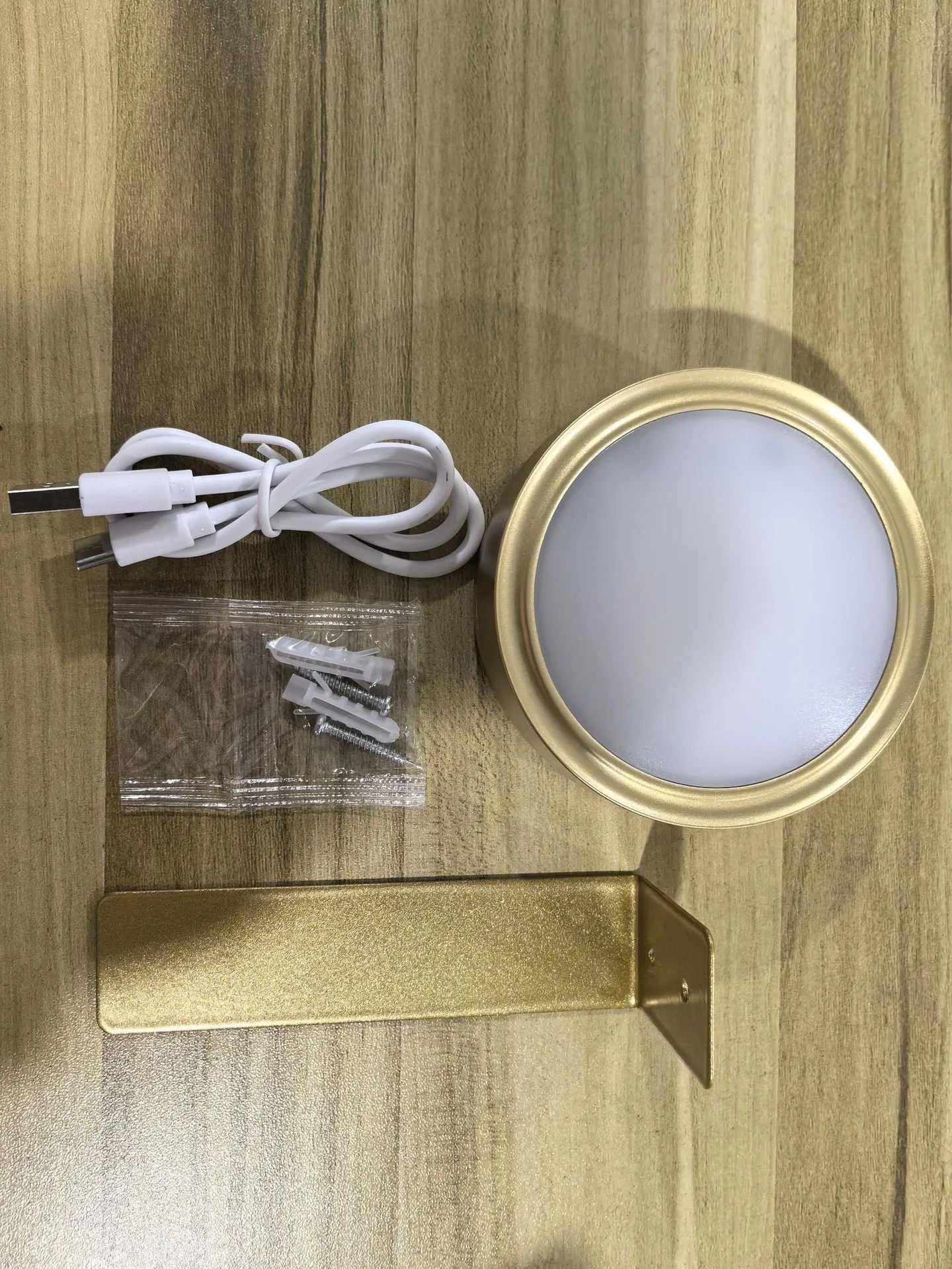 Wireless rechargeable LED painting lamp with magnetic belt attached to a metal frame, remote control nearby.