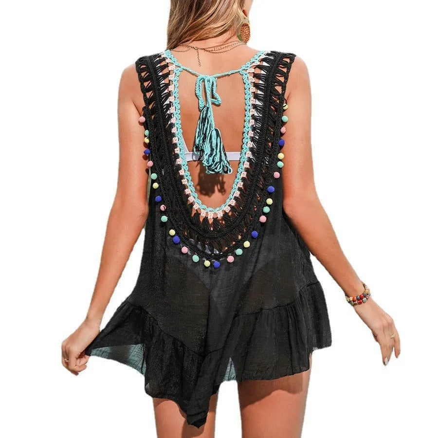 Black hand-crocheted women's beach cover-up vest with cut-out ruffled design.