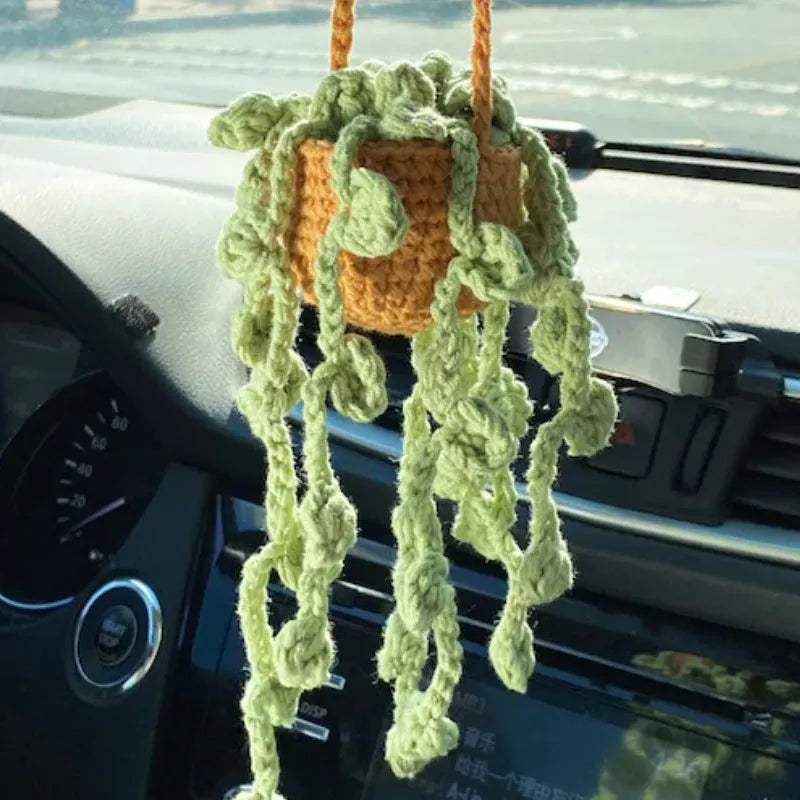 Green and white knitted rope car plant ornament with 8cm base and hanging rope.