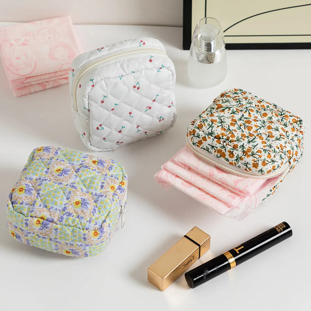 Women's key storage bag in floral polyester with sewing thread details, showing multiple colour and pattern options
