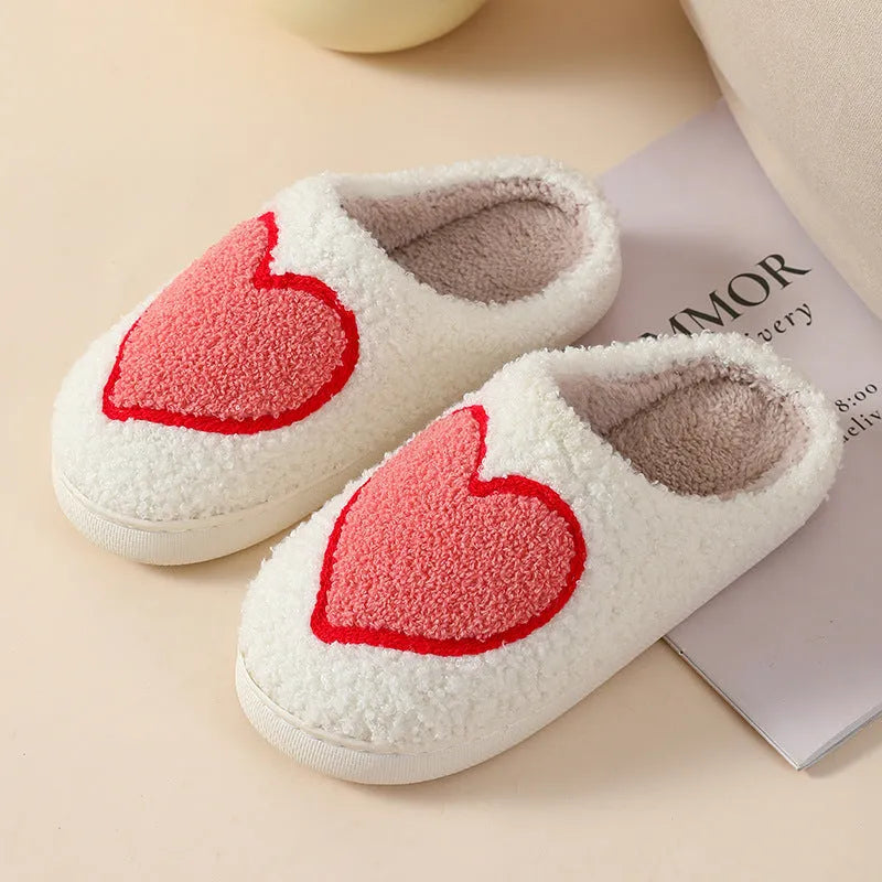 Plush women's slippers in Big Love colour with non-slip PVC sole and round toe.