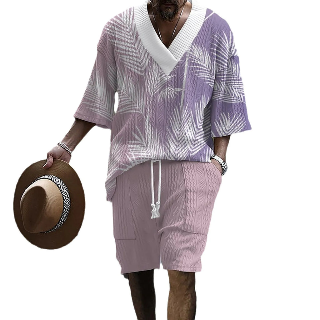 Men's grey printed knitted short-sleeved top and matching shorts on a hanger.