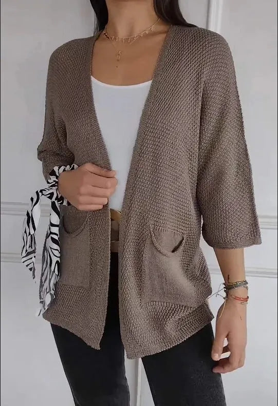 Women's thin waffle knit cardigan coat with nine-quarter sleeves and front pockets in army green.