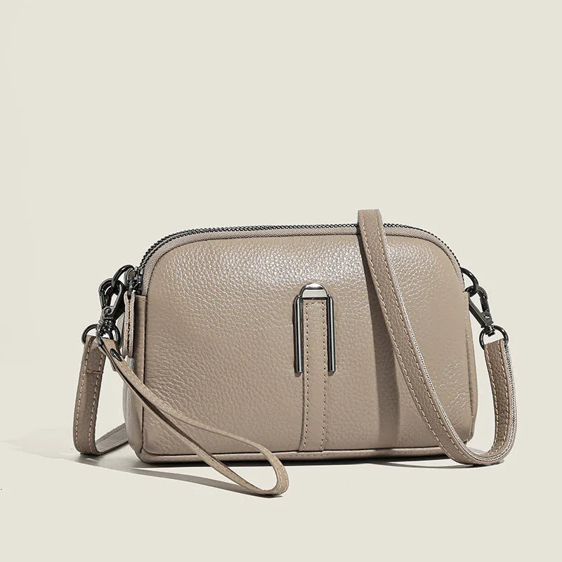 Genuine leather women's square shoulder bag in dark green, showing its horizontal 19x13x6cm shape.