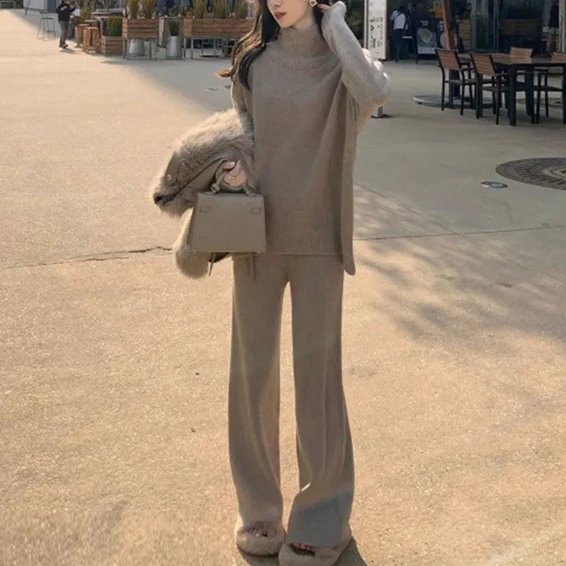 Women's beige acrylic long-sleeve sweater and wide-leg trousers two-piece casual set.