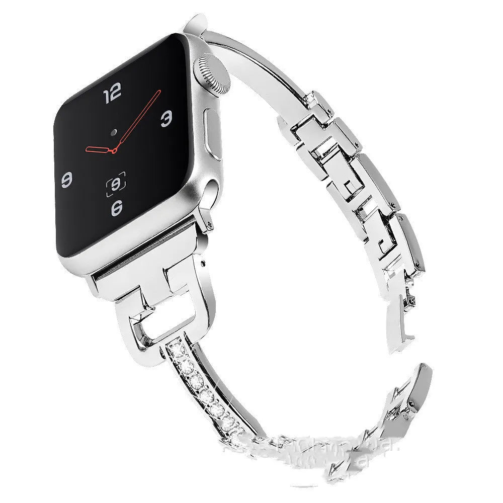 D-shaped metal diamond-pattern strap for Apple Watch in gold colour next to a smartwatch.