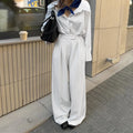 White striped loose fit wide-leg commuter trousers with zip fastening