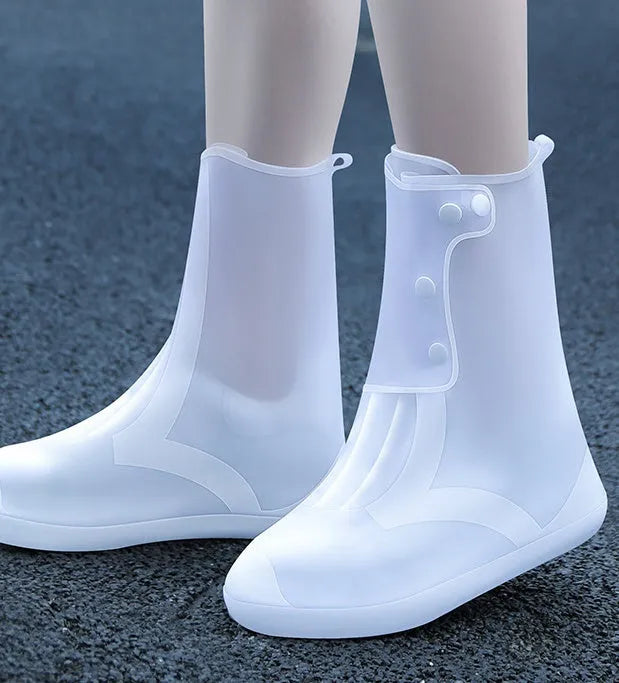 White PVC high top women's water resistant shoe covers with anti-skid soles shown in size options