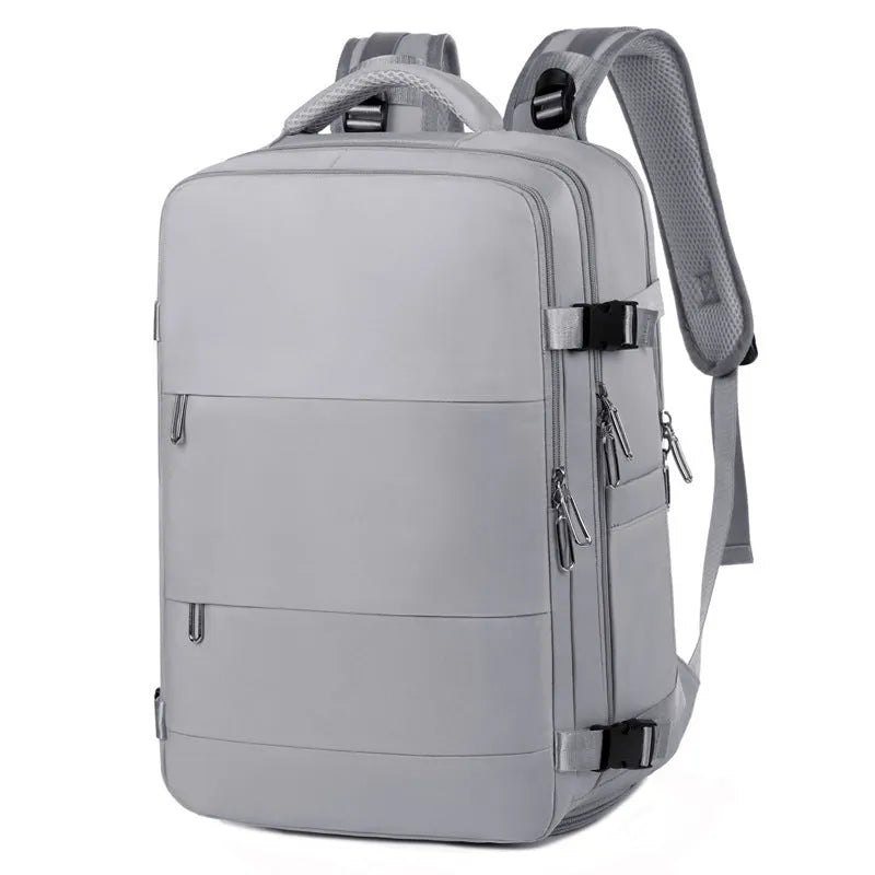 Large purple travel backpack for women with multiple compartments on a grey background.