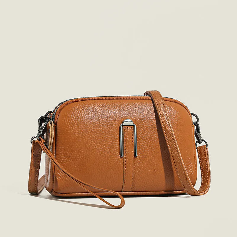 Genuine leather women's square shoulder bag in dark green, showing its horizontal 19x13x6cm shape.