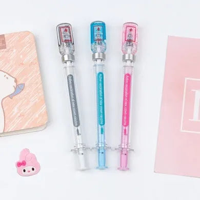 Vaccine pen design gel pen with black refill showing retractable click mechanism and 0.5mm needle tube point