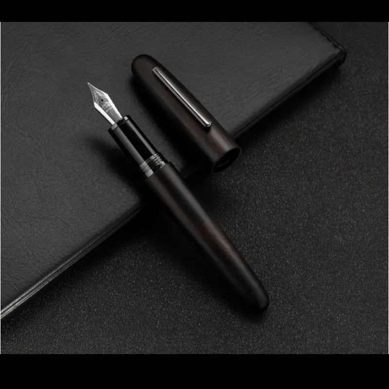 Wooden fountain pen with rotating cap showing choice of ebony, rosewood and tiger ebony finishes