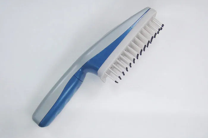 Pet comb with negative ion technology, removable brush head, and 9V battery compartment.