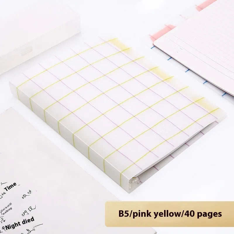 Loose-leaf spiral notebook with PP cover open, showing raw wood pulp pages in A5 or B5 size.