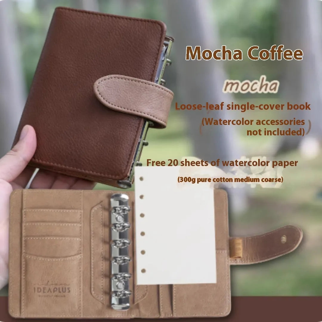 A7 size loose-leaf watercolour notebook in multiple colours, open to show 160gsm paper pages.