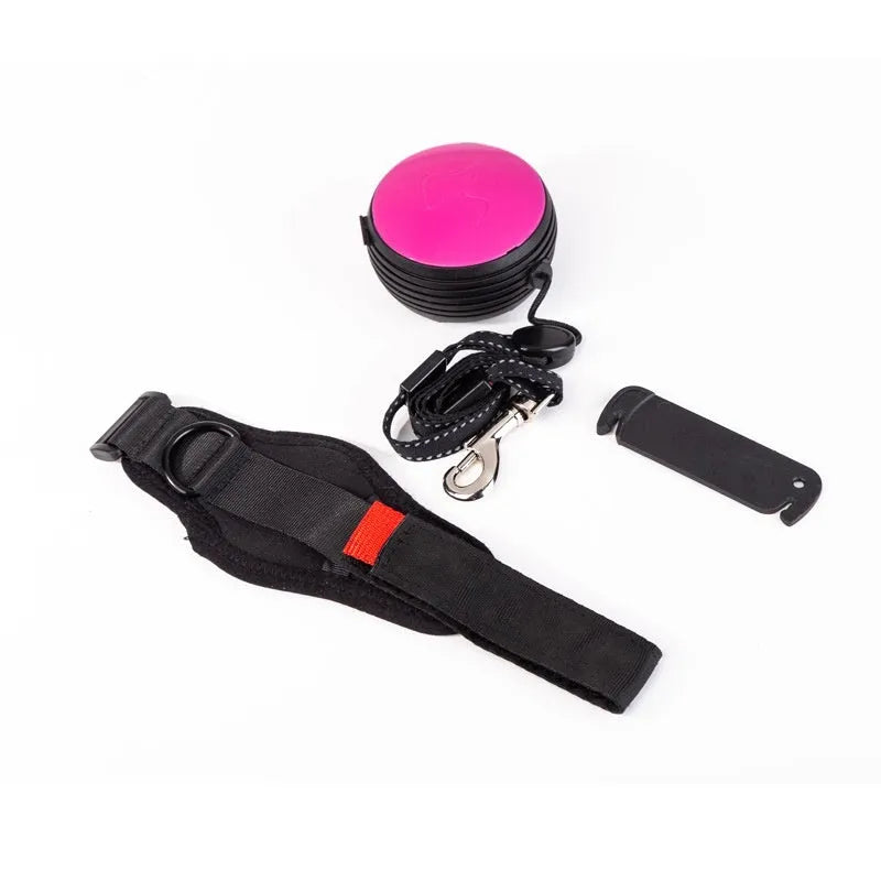 Automatic retractable dog leash extended to 3 metres, shown in vibrant orange colour with ergonomic handle.