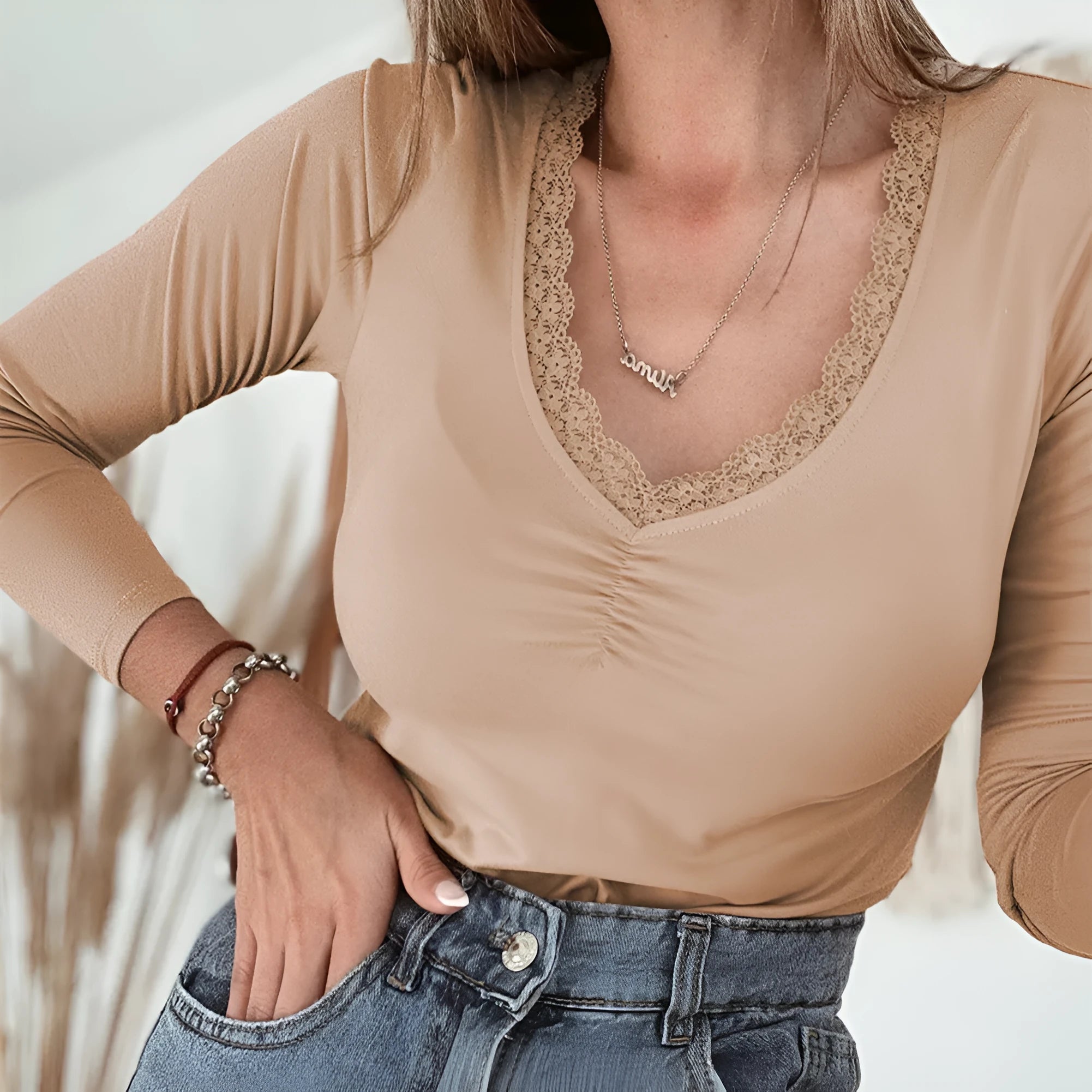 Women's red casual top with lace trim detailing and long sleeves