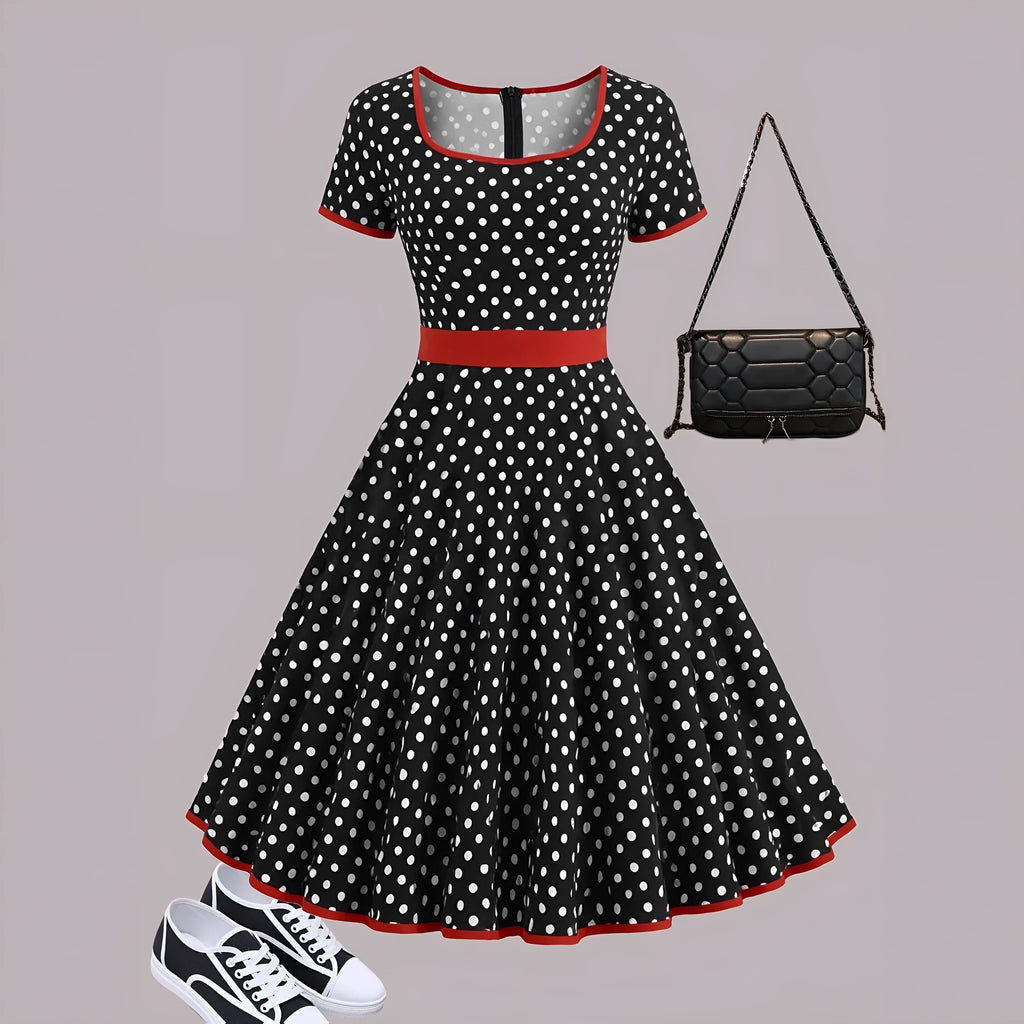 Women's multicolour polka dot pleated dress with square neckline, short sleeves, and front zip.