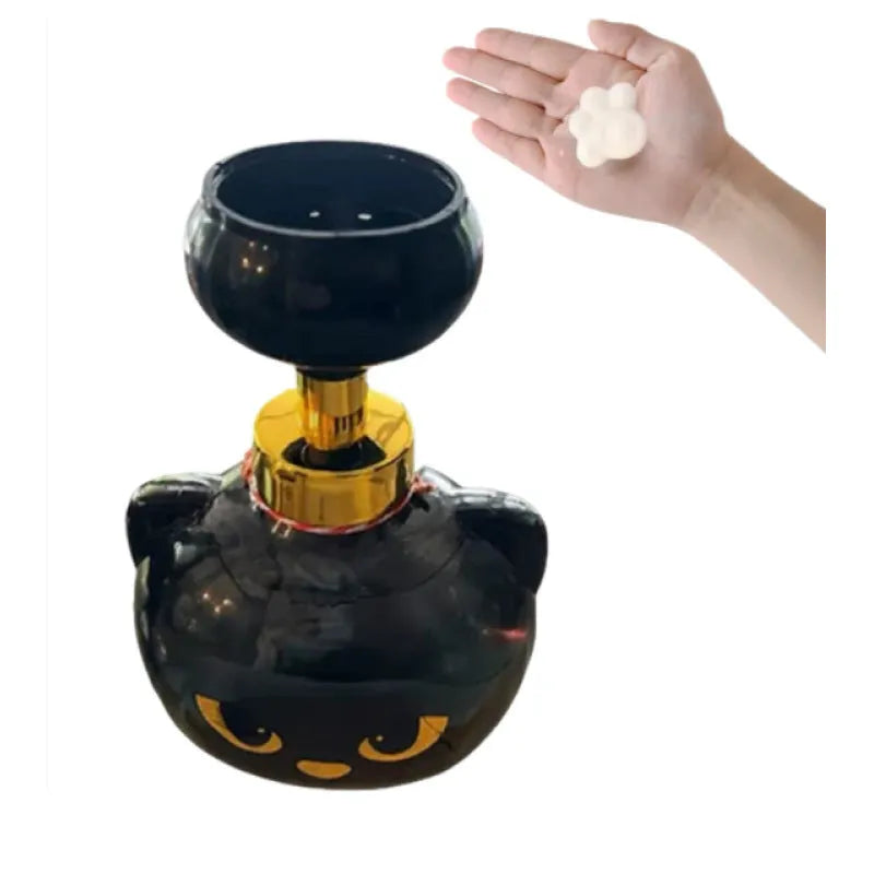 Black plastic cartoon cat-shaped foam soap dispenser measuring 10cm wide by 18cm tall