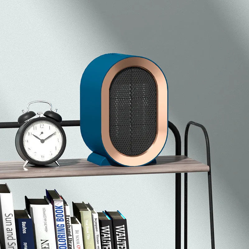 Desktop electric heater with cast metal housing and rotating air outlet in various colour options