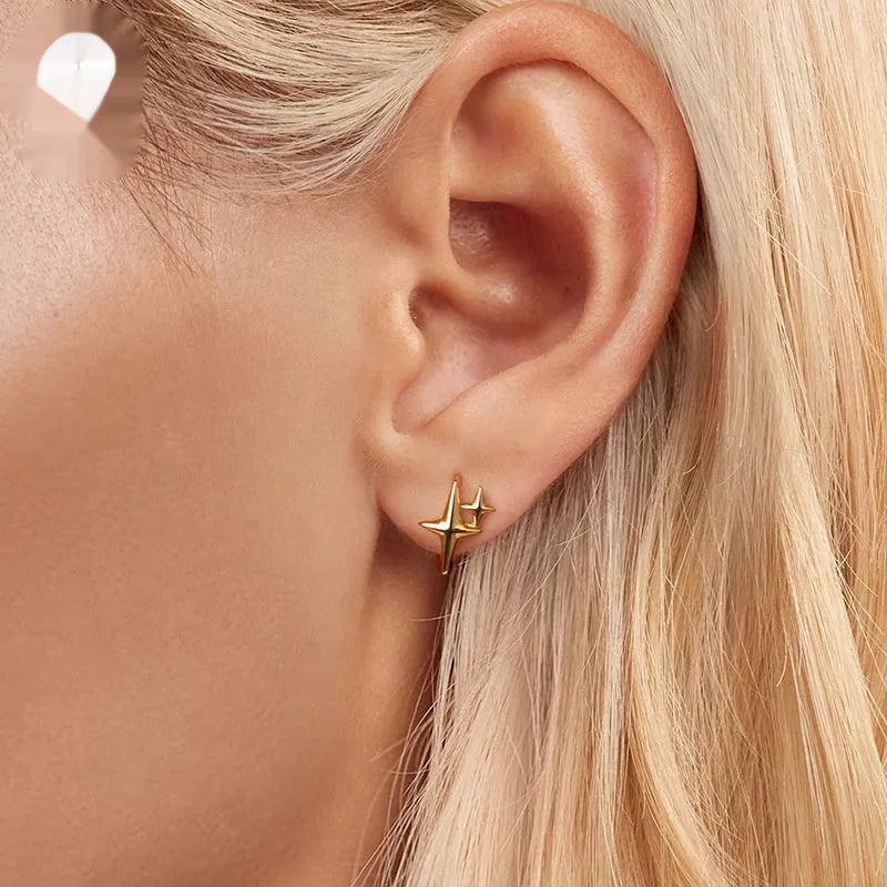 Minimalist oxidised sterling silver star clip earring with a single cubic zirconia stone.